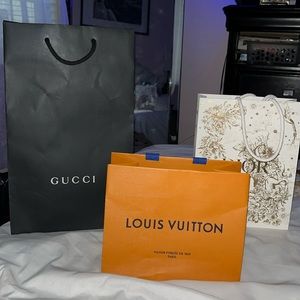 Three designer shopping bags